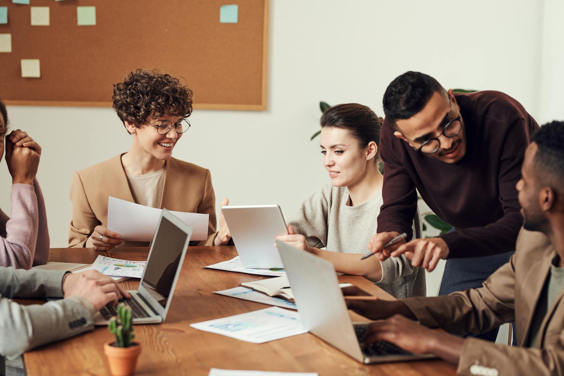 Business professionals working through government paperwork together